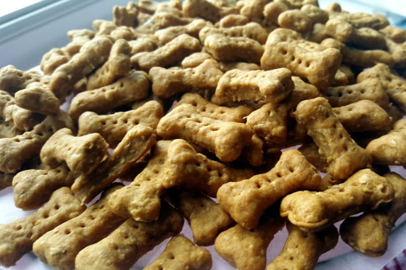 a pile of homemade bone-shaped dog biscuits