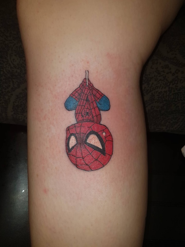 colour tattoo of spiderman hanging upside down