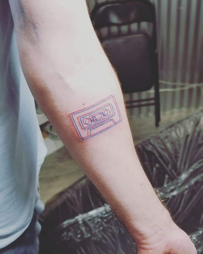 3-D style hand poke tattoo of a cassette tape