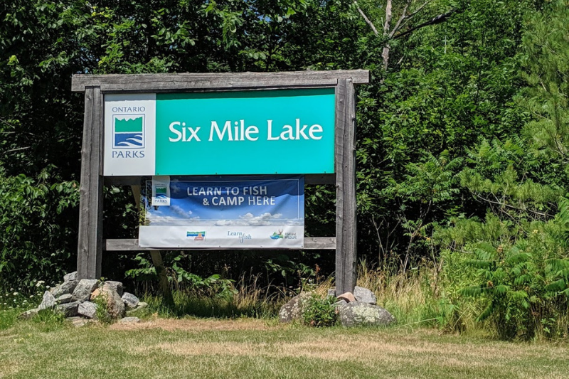 welcome sign located at the entrance to Six Mile Lake Provincial Park