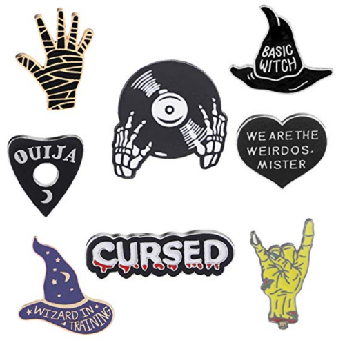 collection of witch-themed enamel pins