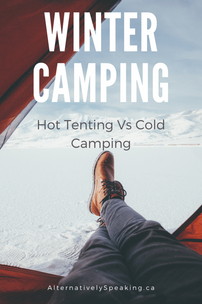 a person's feet sticking out the door of an orange tent, looking out onto the snow with the title winter camping hot tenting vs cold camping