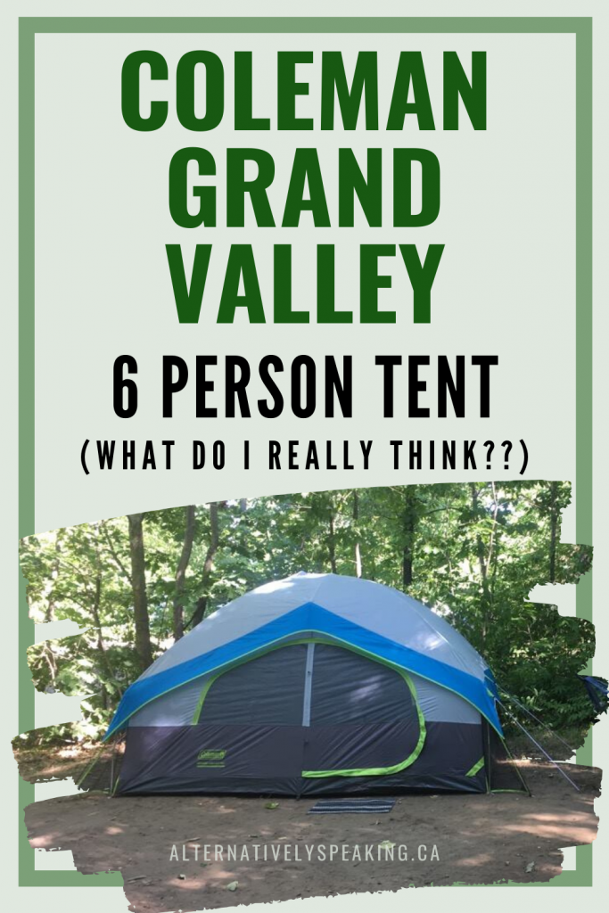 coleman grand valley 6 person tent set up outdoors on a forested campsite on a green background with the tent's brand and model listed