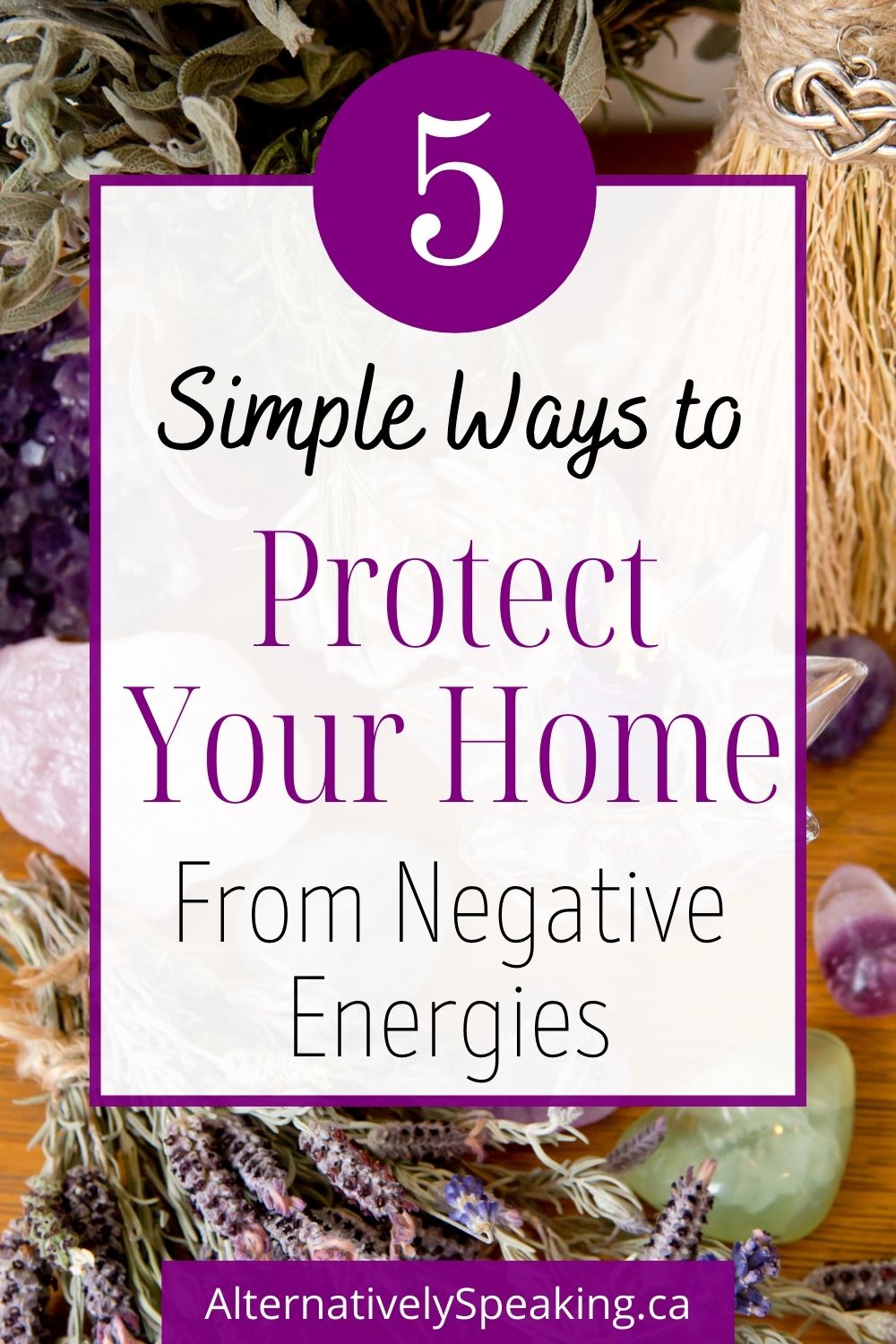 A variety of different crystals laid out on a wooden surface with a bundle of lilac and text overlay stating 5 simple ways to protect your home from negative energy. 